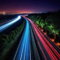 long exposure photo of highway at night with light streaks on the side of the Royalty Free Stock Photo