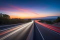 Highway at Sunset with Streaks of Car Lights. Travel and Transportation Background Royalty Free Stock Photo
