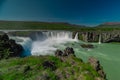 Long exposure photo of magnificent Godafoss waterfall in northern Iceland on a warm summer day. Visible frog from drops of water