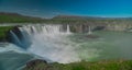 Long exposure photo of magnificent Godafoss waterfall in northern Iceland on a warm summer day. Visible frog from drops of water