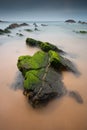 Long exposure photo with rocks in the foreground in Alentejo, Portugal.