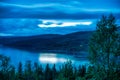 Long exposure photo 30 sec of heavy clouds over Norwegian mountains around Rossvatnet Lake, Northern Norway. Early summer night Royalty Free Stock Photo