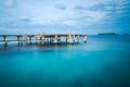 Wooden bridge on a blue sea water Royalty Free Stock Photo