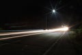 Long exposure photography of a highway with light trailing and street light Royalty Free Stock Photo