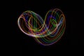 Long exposure photography made with light paint of various colors on a black background, waves, curves and swirls, curvilinear or