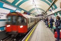 Long exposure photography of a train arriving to a underground platform at Russell Square metro subway