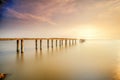 A long Exposure Picture Of abandoned old jetty with cloudy before  burning sunset as background Royalty Free Stock Photo