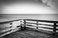 Long exposure a pier and the Chesapeake Bay in Chesapeake Beach, Maryland.