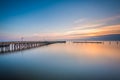 Long exposure of the pier and Chesapeake Bay at sunrise, in North Beach, Maryland.