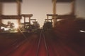 Long exposure railway train travel and movement, concrete infastructure on the side