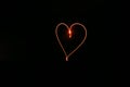 Long exposure red heart black background Royalty Free Stock Photo