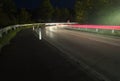 Traffic at Night - Red and White Light Trails around a Highway Corner Royalty Free Stock Photo