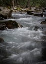 Long Exposure of Rushing Water over Rocks Royalty Free Stock Photo