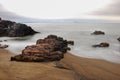 Long exposure of the sea hitting some rocks in Mansa beach, Uruguay Royalty Free Stock Photo