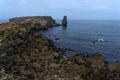 Long exposure seascape of the cliffs of Papoa island in Carvoeiro cape from the sea at sunrise in a cloudy day, Atlantic coast, Royalty Free Stock Photo