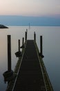 Small jetty in a North Wales harbour. Flat summer sea at dawn in Rhos on sea.