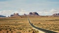 Long exposure shot of cars traveling along highway 163 at monument valley in utah Royalty Free Stock Photo