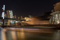 Long exposure shot of the contemporary building of the museum of Frank Gehry Guggenheim at night Royalty Free Stock Photo