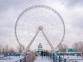 Long exposure shot of a ferris wheel in the middle of a winter day. Dark scene. Montreal, Quebec, Canada Royalty Free Stock Photo