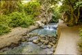 A long exposure shot of the Monachil river cascading over a small weir in the Sierra Nevada mountains, Spain Royalty Free Stock Photo