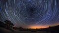 long exposure shot of the night sky, capturing the rotation of the Earth and the movement of stars