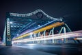 Long exposure shot of the Queen Street Viaduct in Toronto, Canada with light trails of moving cars.