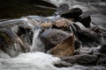 Long exposure shot of a small rocky cascade in the daylight Royalty Free Stock Photo