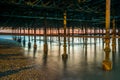 Long exposure shot of structural supports under pier