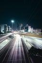 Long exposure shot of the traffic lights with the illuminated Monterrey city in the background