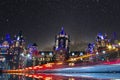 Long exposure shot of vehicle light trails with milkyway and Iconic structure in background. Focus on lights. Mumbai. India