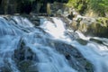 Long exposure shot of the water flows through the rocks Royalty Free Stock Photo