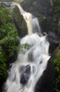 Long exposure shot of a waterfall. Milky shots of water flowing from the mountain Royalty Free Stock Photo