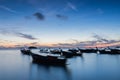 Long exposure silhouette long tail boats with sunrise sky in Koh Lipe Island
