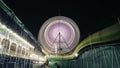 Long Exposure slow shutter speed Shot of a Spinning Ferris Wheel with beautiful lights in indian Fun Fair at night Royalty Free Stock Photo