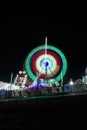 Long Exposure slow shutter speed Shot of a Spinning Ferris Wheel with beautiful lights in indian Fun Fair at night Royalty Free Stock Photo