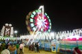 Long Exposure slow shutter speed Shot of a Spinning Ferris Wheel with beautiful lights in indian Fun Fair at night Royalty Free Stock Photo