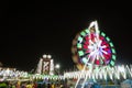 Long Exposure slow shutter speed Shot of a Spinning Ferris Wheel with beautiful lights in indian Fun Fair at night, selective Royalty Free Stock Photo