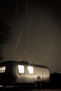 Star swirl above desert Airstream campsite. Royalty Free Stock Photo