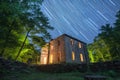 long exposure of star trails with a meteor shower streaking across