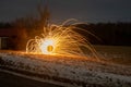 Long exposure of steel wool sparks in a field Royalty Free Stock Photo