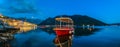 Sunset panorama of Kotor Bay and a docked boat in the town of Perast, Montenegro Royalty Free Stock Photo