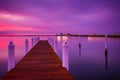 Long exposure at sunset of a pier and the Chesapeake Bay Bridge, seen from Kent Island, Maryland. Royalty Free Stock Photo