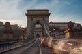 Long exposure in the sunshine. Cars drive fast over the Chain Bridge on the banks of the Danube in Budapest Royalty Free Stock Photo