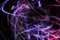 Long exposure swirl of blue and purple lights painting with bright patterns
