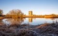 Long exposure of Threave Castle reflecting on the River Dee in the winter sun