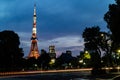 A long exposure of traffic passing by Tokyo tower at night Royalty Free Stock Photo