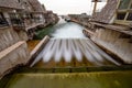 Long exposure of a tranquil river winding through a peaceful residential neighborhood in Fishtown