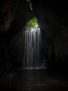 Long exposure of tropical rainforest secret hidden cave canyon waterfall Tukad Cepung in Bali Indonesia South East Asia Royalty Free Stock Photo