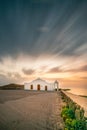 Long exposure of the typical Greek church Chapel of Agios Nikolaos on Zakyntos, on the sunrise at the sea