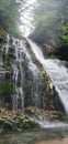 Long exposure vertical view of Urlatoarea Waterfall in the Bucegi Mountains, Romania